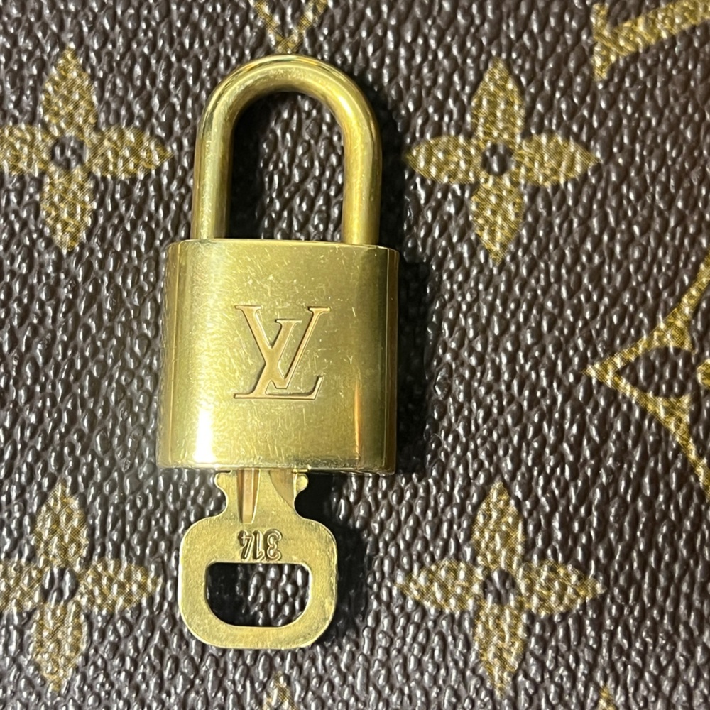 SOLD ✨ Authentic Louis Vuitton Lock And Key Polished Bronze #314